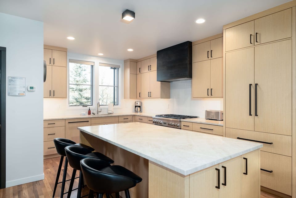 Large kitchen island with additional seating for three