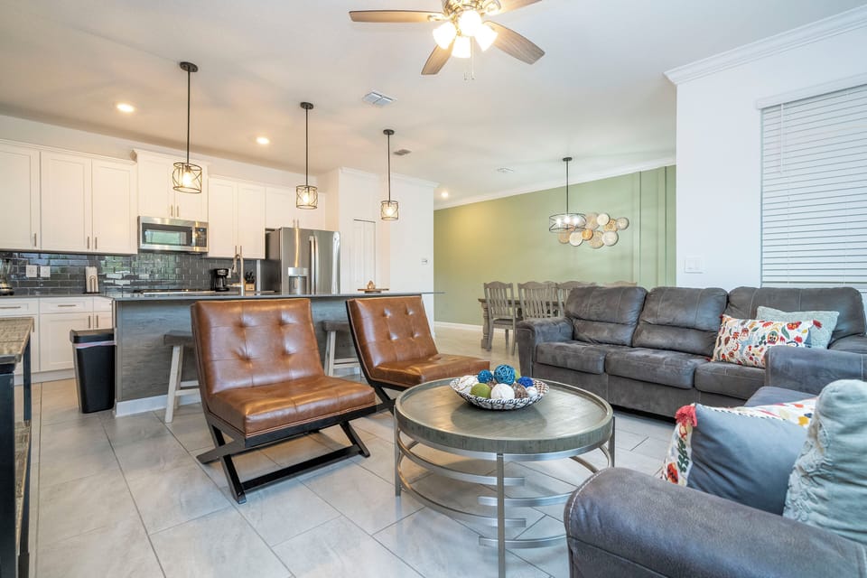 Welcome to our spacious and beautifully adorned living room, complete with a state-of-the-art smart TV where you can stream all your favorite shows. 
