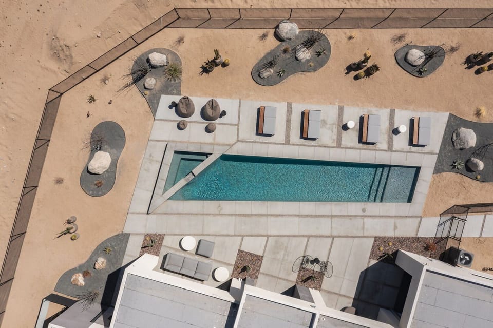 Private pool (pool heating available with fee) & hot tub, with ample lounging, seating, dining, and fire pit