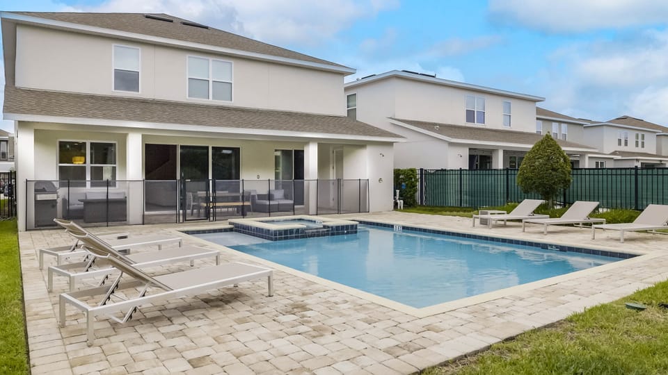 - Private pool with lounge chairs for sun filled Orlando vacations  
- Vacation rental near Disney with outdoor seating and relaxation  
- Family friendly home with pool and fenced outdoor space
- This home no longer has a grill