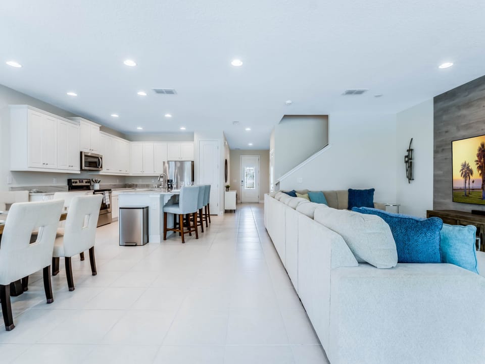 - Open concept living and kitchen area with oversized sectional  
- Orlando vacation rental near Disney with modern family design  
- Spacious rental home with comfort and entertainment features