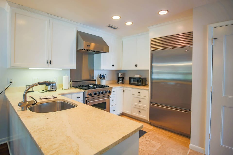 The kitchen features a Viking range and a Subzero built-in refrigerator.