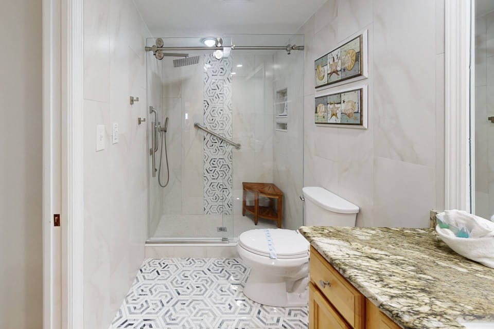 The bathrooms are modern and spa-like, ensuring a rejuvenating experience throughout your stay.