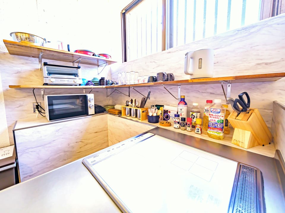 Full-size fridge, microwave, stovetop, electric kettle