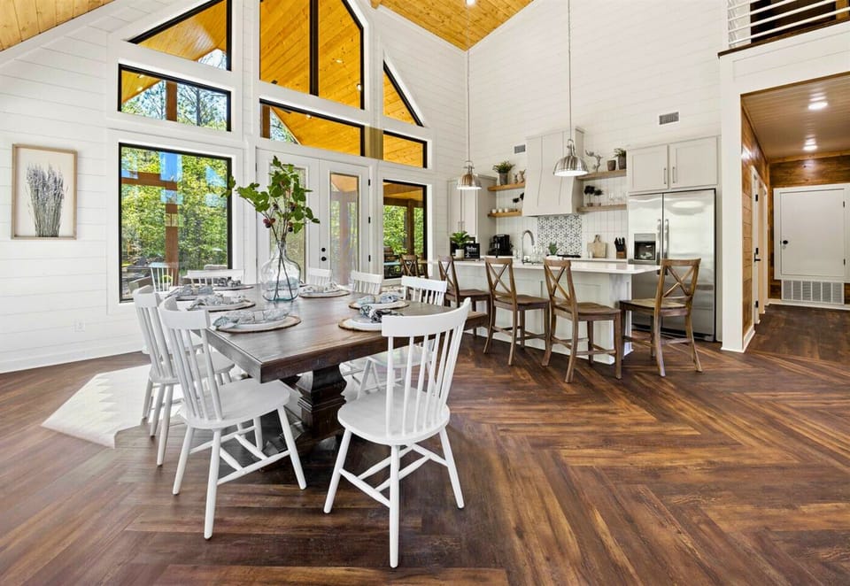 Soaring ceilings and an open layout make this space feel like a breath of fresh air. A dining and living area designed for making memories with loved ones