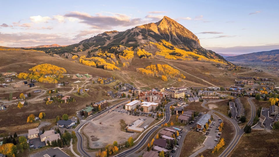 ⓧ REMOVE (redundant) — Sunset over the Fall Foliage featuring The Grand Lodge & Mt. Crested Butte | Managed by: @TraverseHospitality