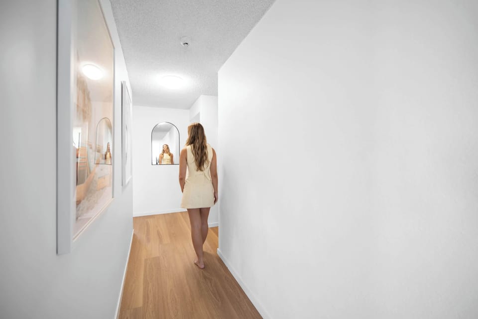 Down the hallway you will find the two bathrooms and the three bedrooms.