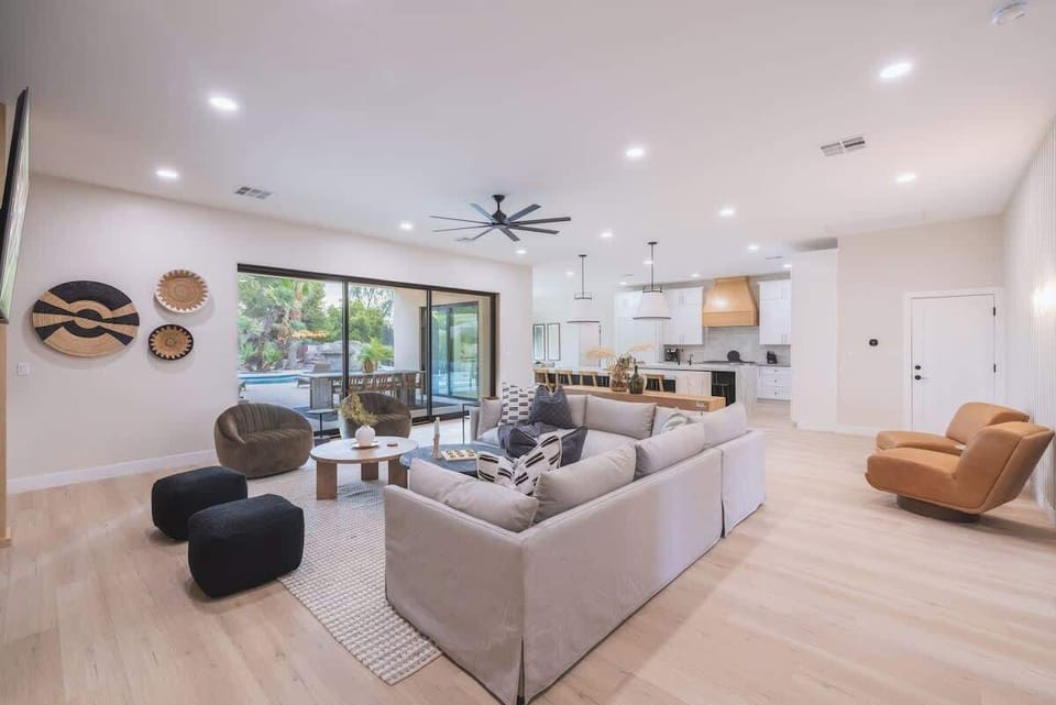 Bright and inviting living area with modern touches and backyard access.