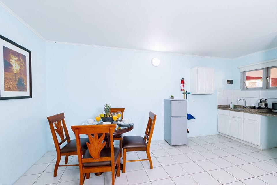 A spacious kitchen layout with a fridge, stove, and microwave.