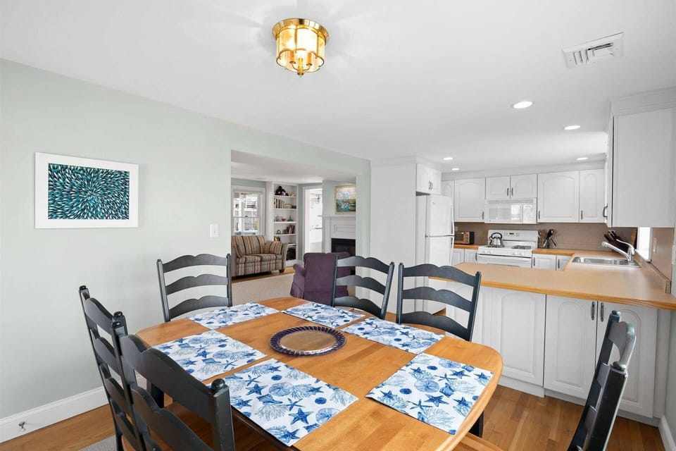 Dining area and views of the living room and kitchen