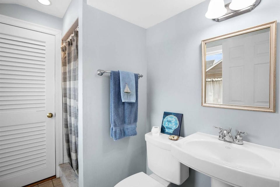1st floor bathroom with stand up shower and access to laundry with washer and dryer