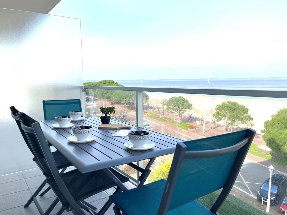 Sky, Table, Furniture, Property, Water, Building, Cloud, Chair, Azure, Tableware