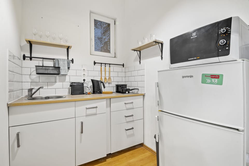 Deluxe Suite | Private kitchen | Full-size fridge, microwave, stovetop, espresso maker