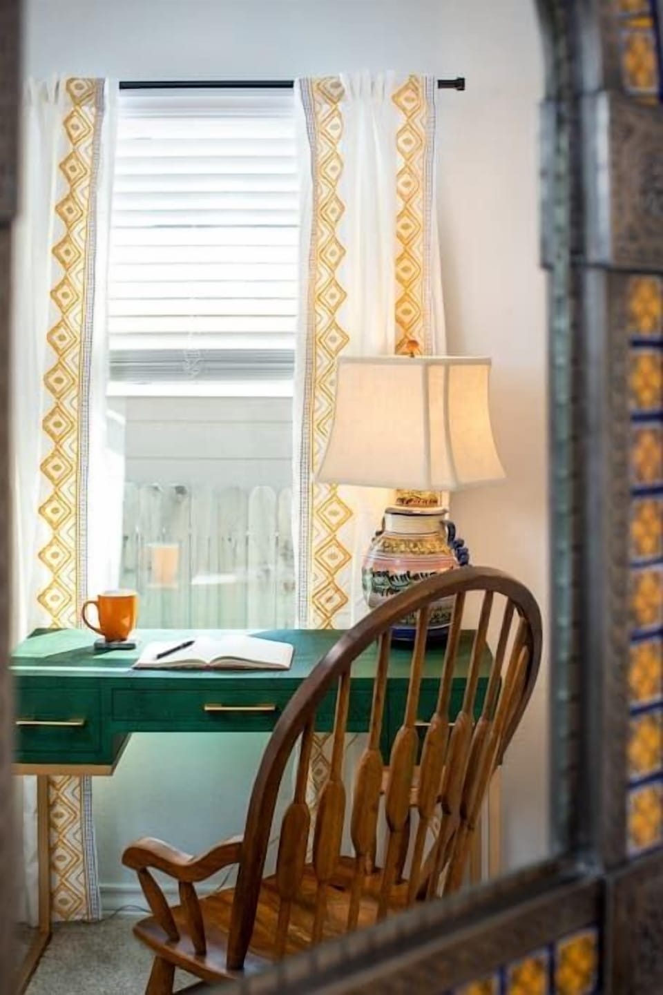 Work from home at the green desk. This window gives great light for your zoom calls! 