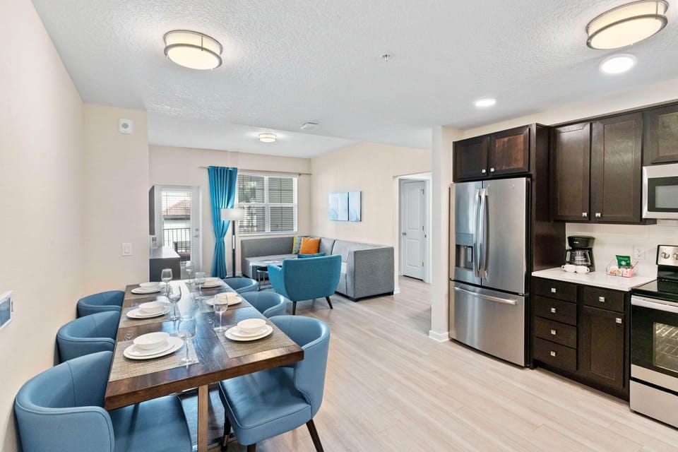 Marvelous dining area of the townhouse at Vista Cay Resort - Embodies elegance and warmth, providing guests with a tasteful setting to enjoy culinary delights. - Stunning wooden furnished floor - Cozy ambiance