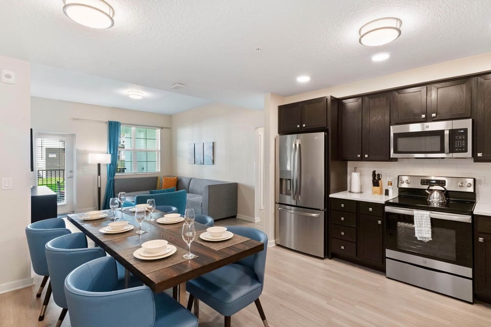 City Chic Cuisine: Our living space is a chic fusion of kitchen and dining, offering a stylish setting for both culinary adventures and shared meals