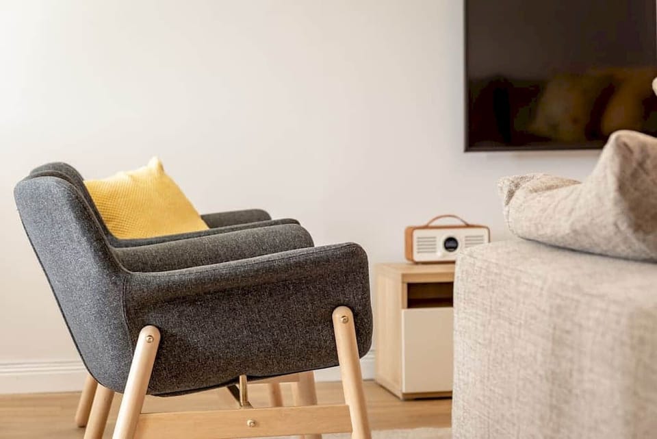 Spacious living room at 5 Abbey Villa, featuring modern décor, comfortable seating, and plenty of natural light.