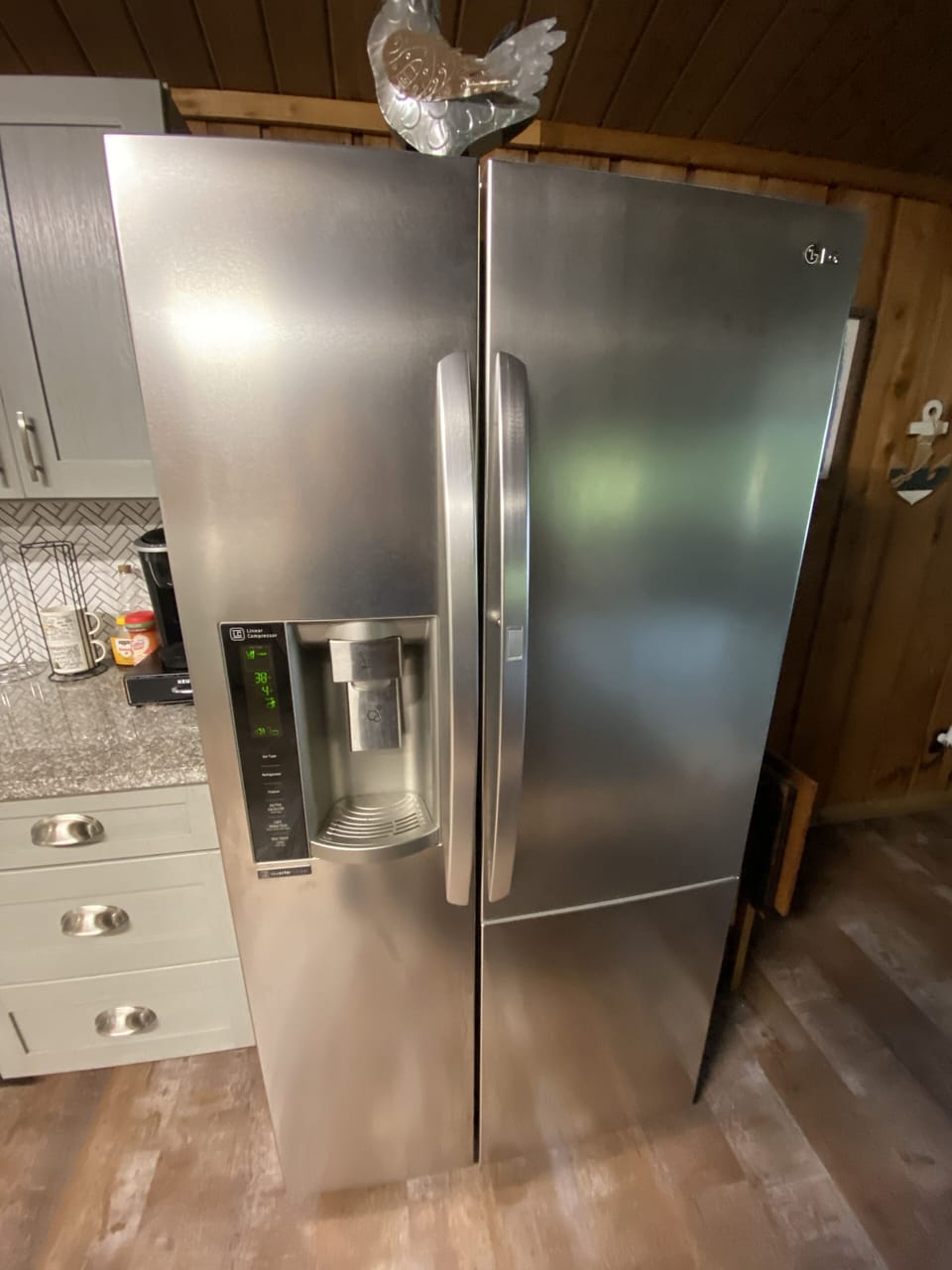 Full size stainless steel refrigerator with filtered water and ice maker. 