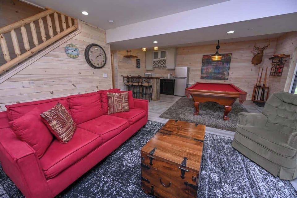 Lower Level- sofa bed is the red couch. Additional linens provided in bedroom closet.  