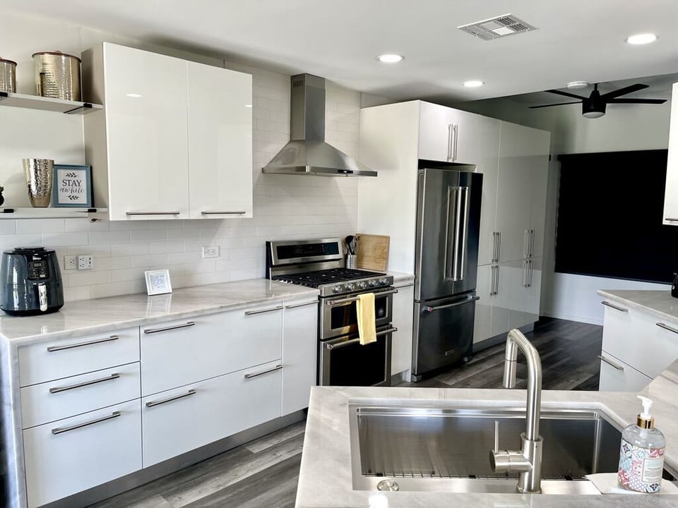 Kitchen with a lot of storage cabinets.