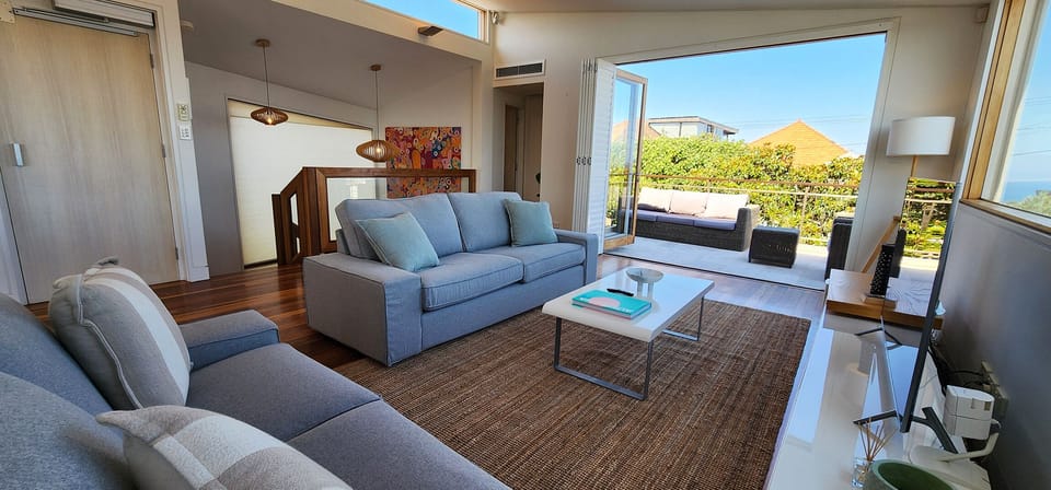 Living room and kitchen upstairs - beautiful ocean views
