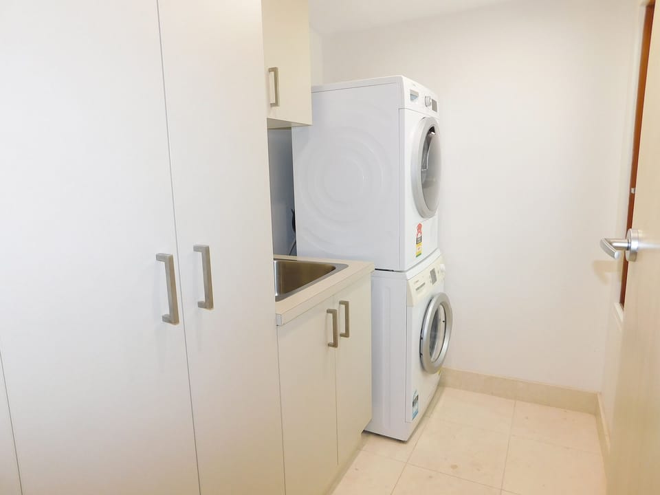 Internal laundry room with washing machine and dryer