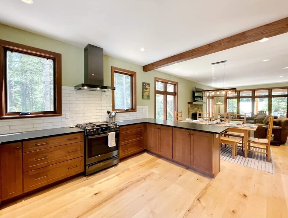 Open floor plan great room with dining room, living room and kitchen