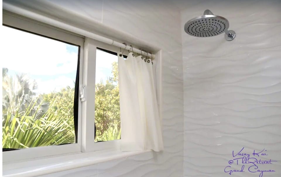 Rainhead shower while you enjoy a treetop view