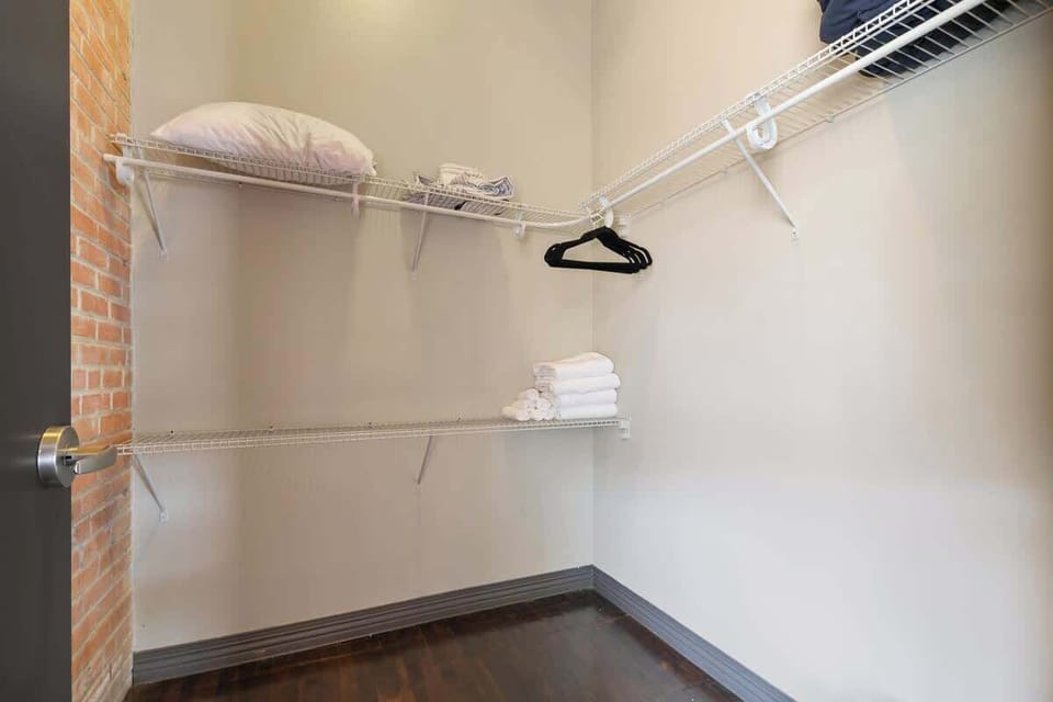 Stay organized with ample shelves and ironing essentials at your fingertips!