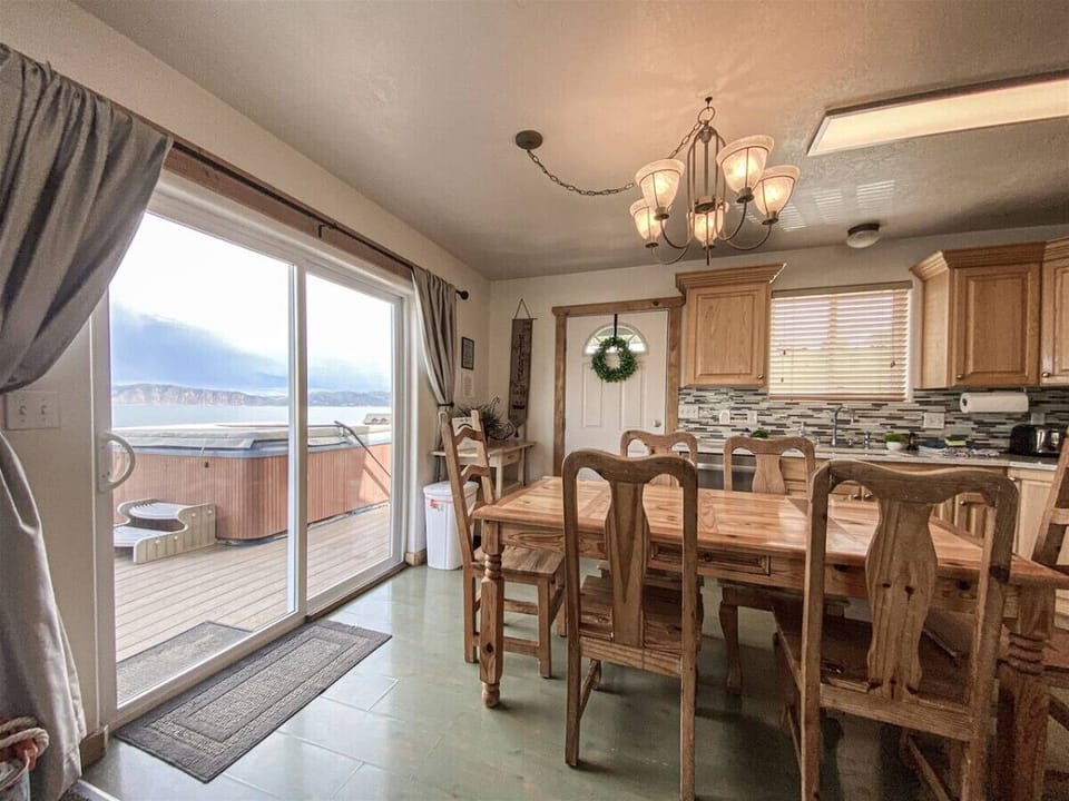 Dine with lake views and step outside to relax in the hot tub—pure serenity.