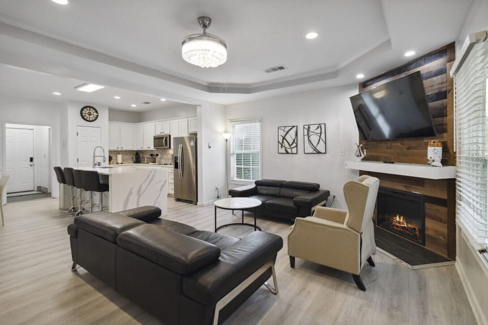 Welcome to your ultimate modern sanctuary — the living room where style meets comfort! Sink into sleek leather couches that scream luxury, surrounded by clean lines, bold accents, and a vibe so fresh it redefines contemporary living. This isn`t just a liv