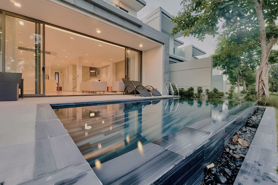 A view of Villa's exterior from the backyard, with a vista of BRG golf course. 