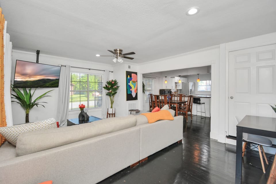 View of the living area which flows to the dining and kitchen areas
