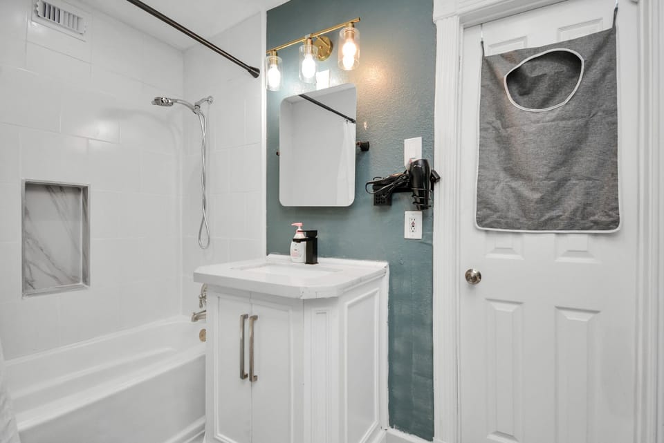 Bathroom #1: Very well-lit bathroom, that is fully equipped with amenities 