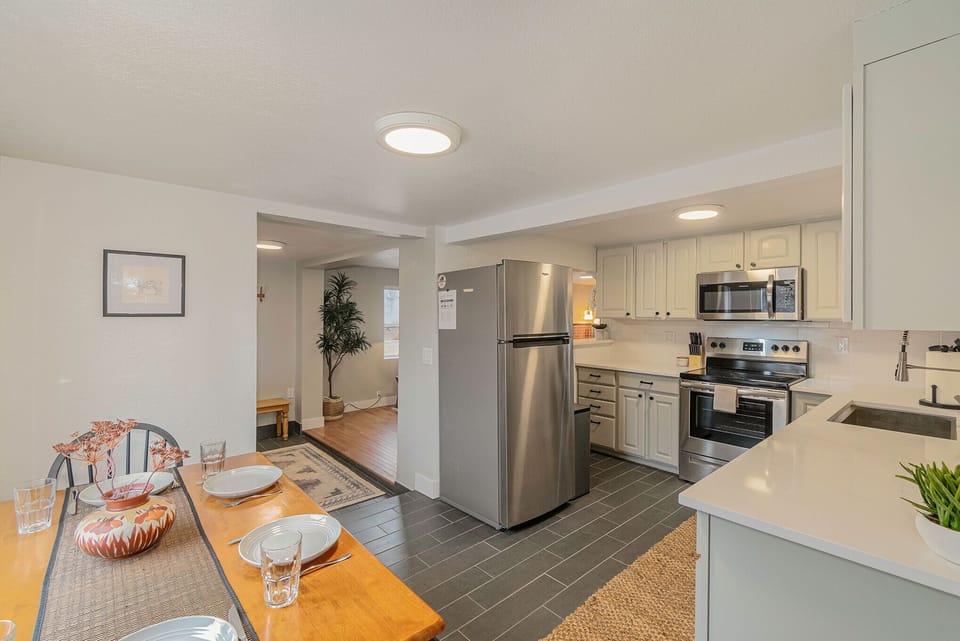 - Set the table for a home cooked dinner or quick bite in this casual dining area
- Stainless appliances and classic cabinetry make cooking easy and enjoyable
- Seamless flow from kitchen to living area makes hosting or relaxing effortless