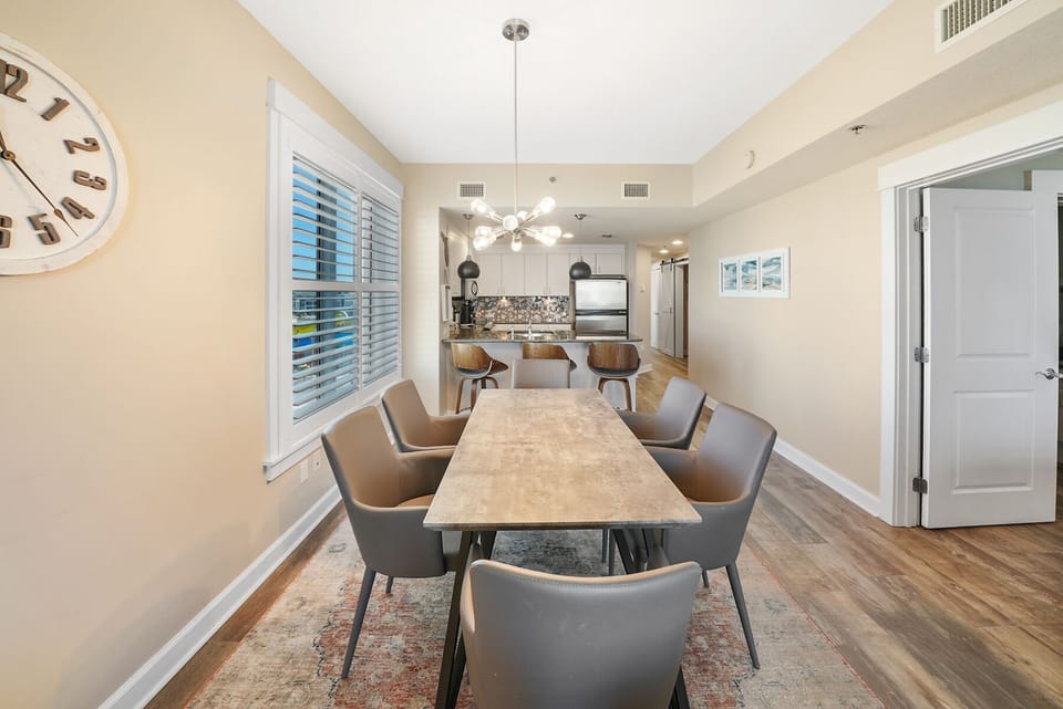 Gather around this elegant dining table for memorable meals, with a modern kitchen perfectly positioned for easy entertaining and conversation.