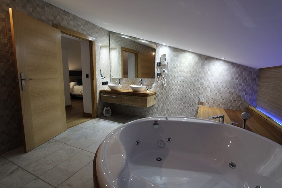 Luxury Studio Suite | Bathroom | Designer toiletries, hair dryer, bathrobes, towels
