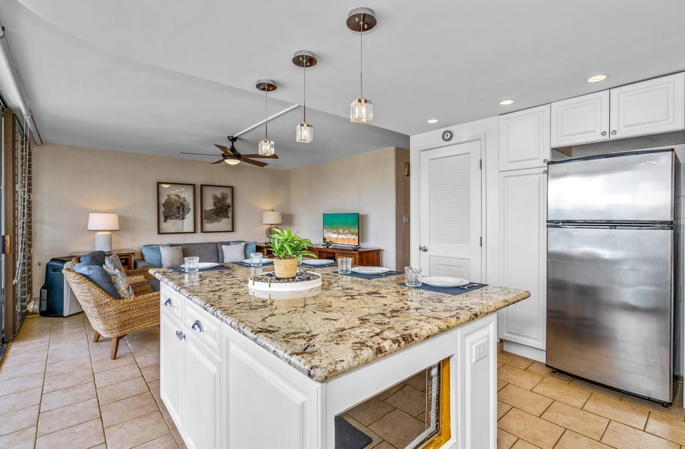 Living room and kitchen area with an open concept.