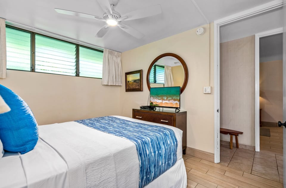 Private guest room with smart tv  and ceiling fan