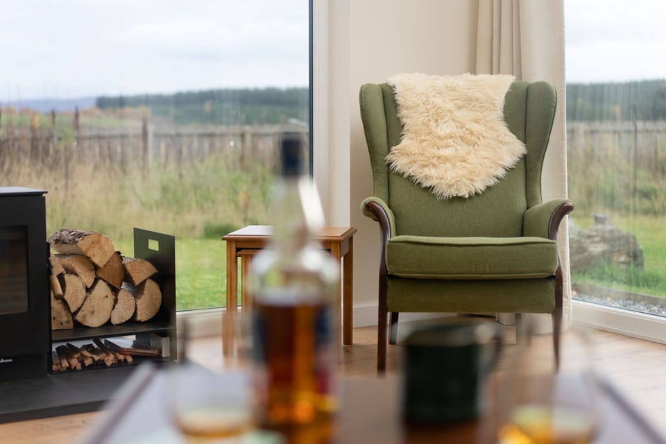 Rivercroft living room with whisky and a view
