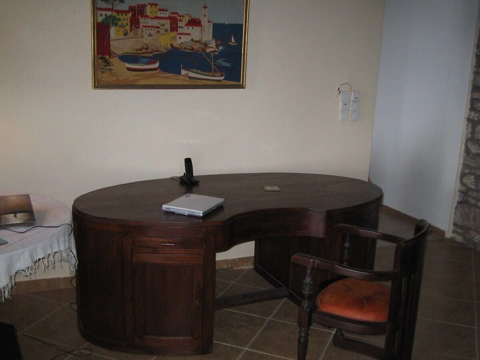 Home office, desk dedicated for work space  , including  internet  router. This work space  is locate inside the sitting room .
