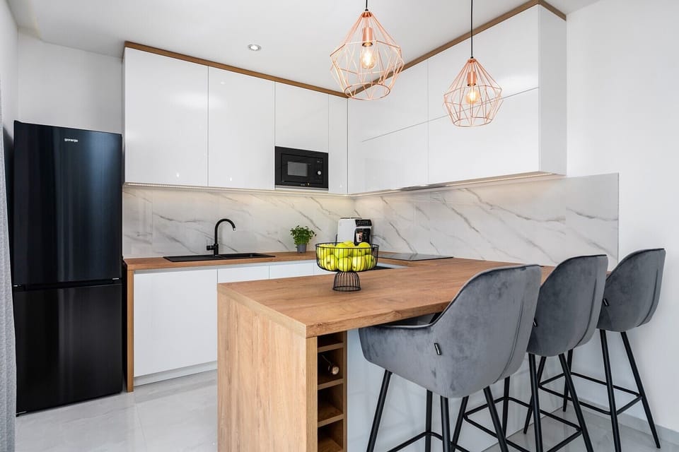 The kitchen island has all the amenities a modern guest needs.
