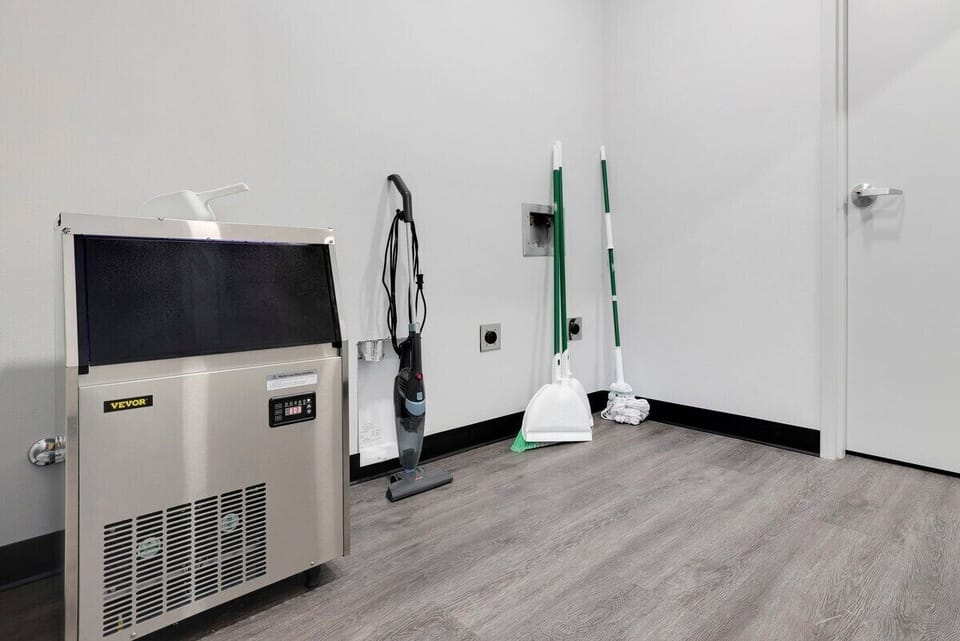 Cleaning supplies and an ice machine can be found in a shared closet in the hallway.