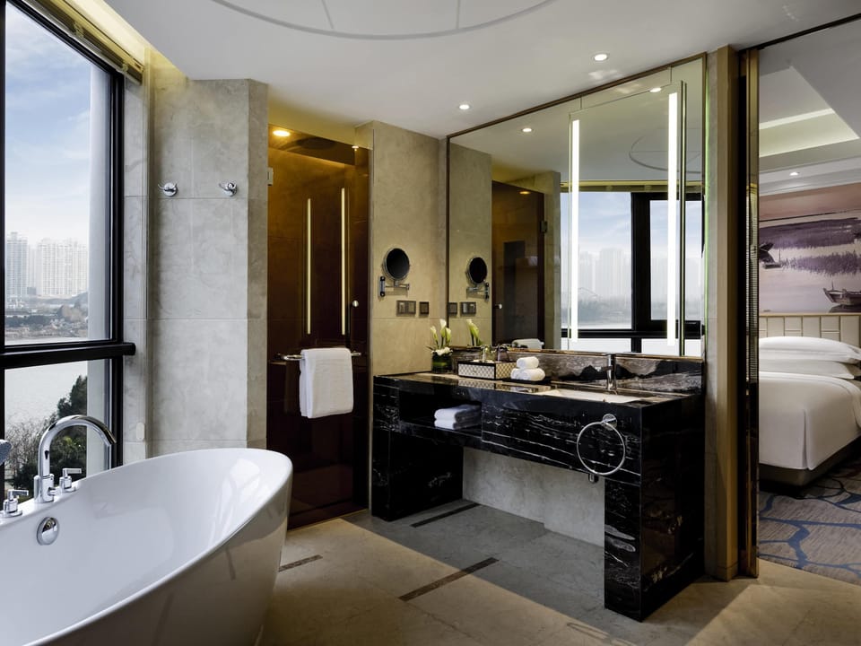 Deluxe Suite, 1 King Bed, Club Lounge Access, River View | Minibar, in-room safe, desk, laptop workspace