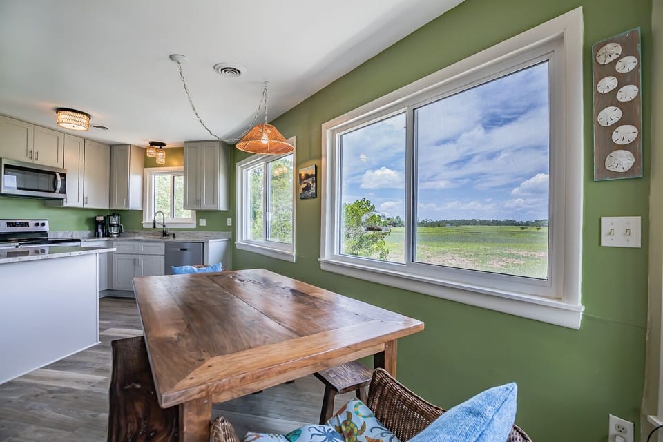 dining area with bird feeder attached to window