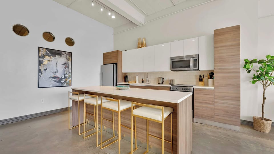 Modern Kitchen: Sleek design with gold accents, perfect for culinary adventures and gatherings!