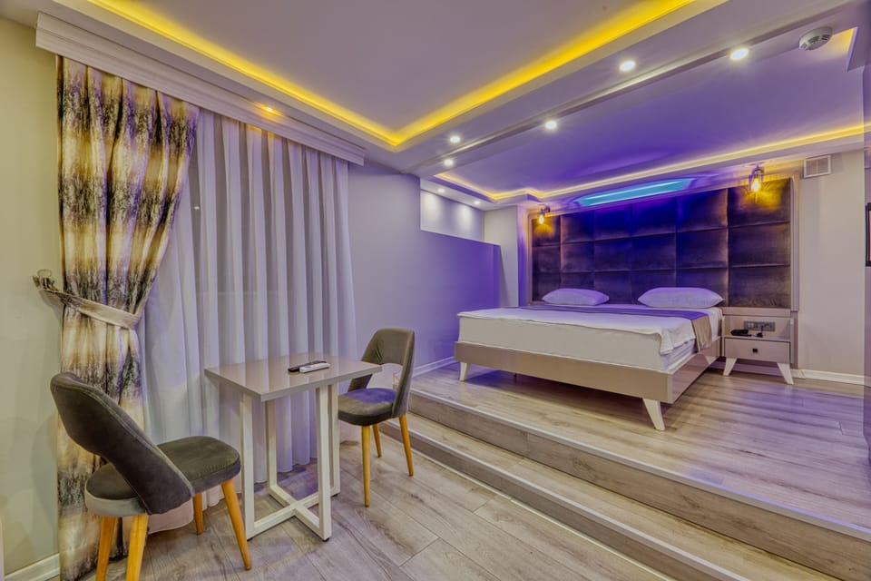 Economy Double Room | Living area | 50-cm LCD TV with satellite channels, TV