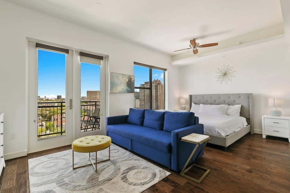 Bright space with stunning views, stylish decor, and a plush sofa for relaxation!