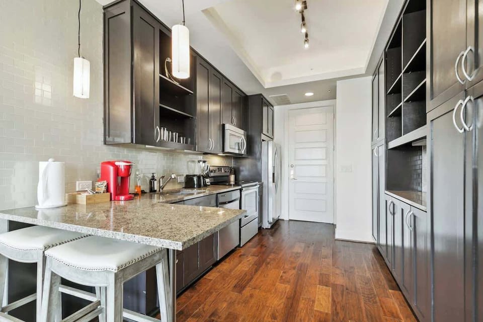 Whip up culinary delights in this stylish, light-filled kitchen with sleek finishes!