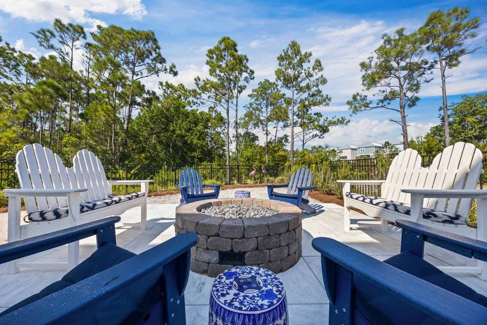 Backyard Firepit area with plenty of seating and natural gas Firepit.